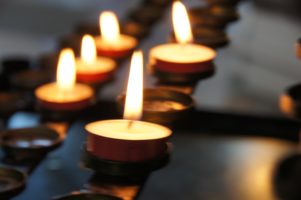 Burning candles in memory of loved ones